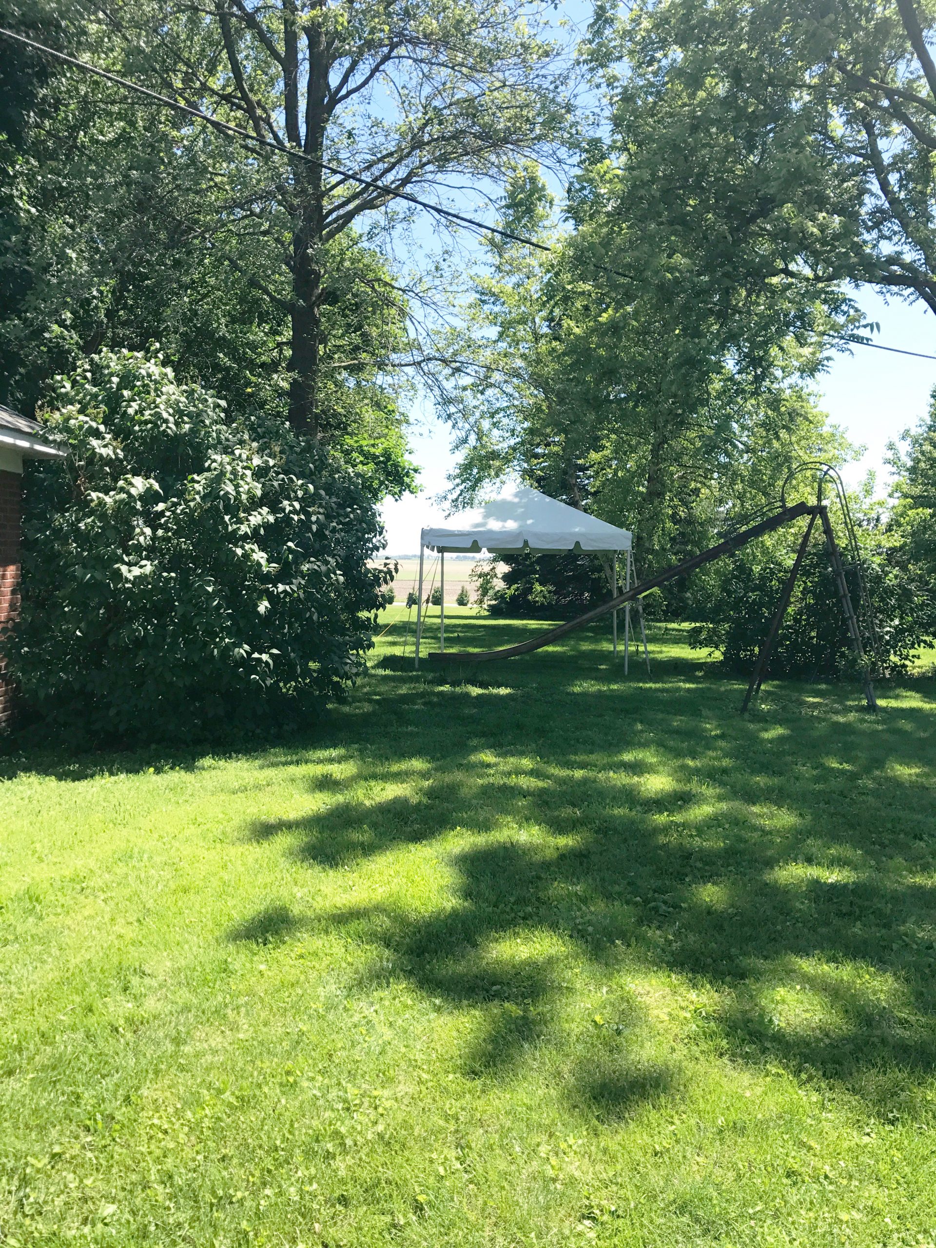 10' x 10' frame tents setup at an outdoor wedding in Iowa