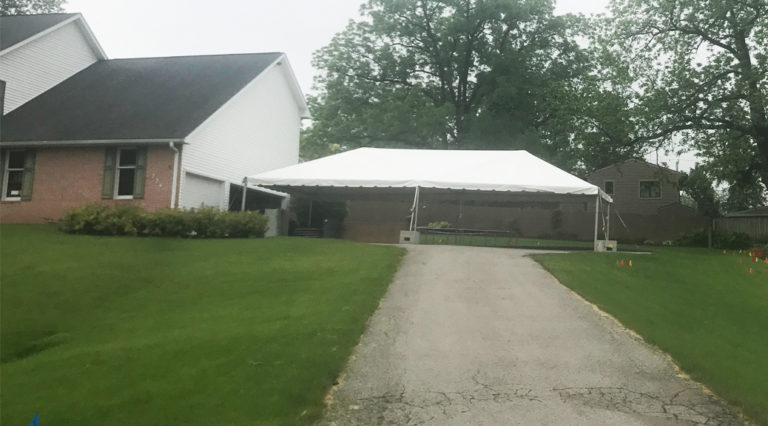 20′ x 40′ frame tent on a driveway for a Graduation Party in Iowa