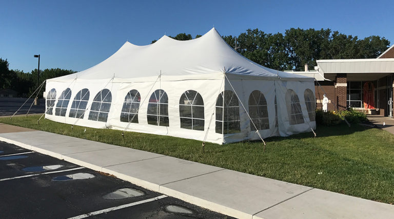 20' x 40' rope and pole tent with French Sidewalls for a wedding reception at a St John Vianney Church in Bettendorf, IA