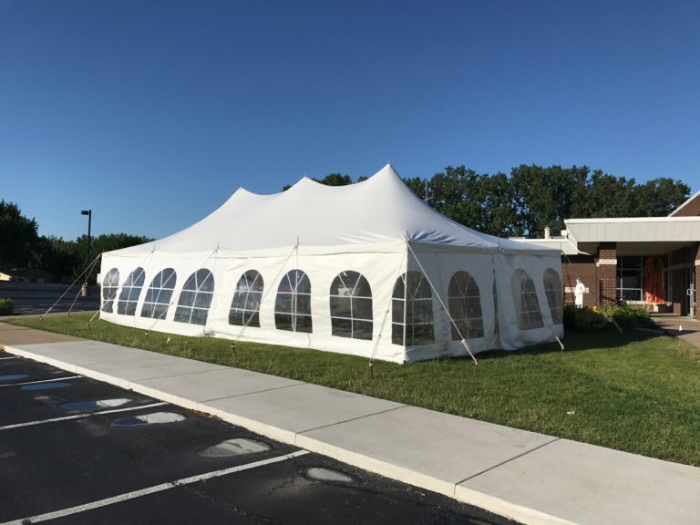 20' x 40' rope and pole tent with French Sidewalls for a wedding reception at a St John Vianney Church in Bettendorf Iowa