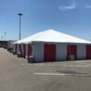 30' x 60' frame tent at the Walmart Supercenter in Cedar Rapids, Iowa with red and white side walls for Fireworks stand in the parking lot