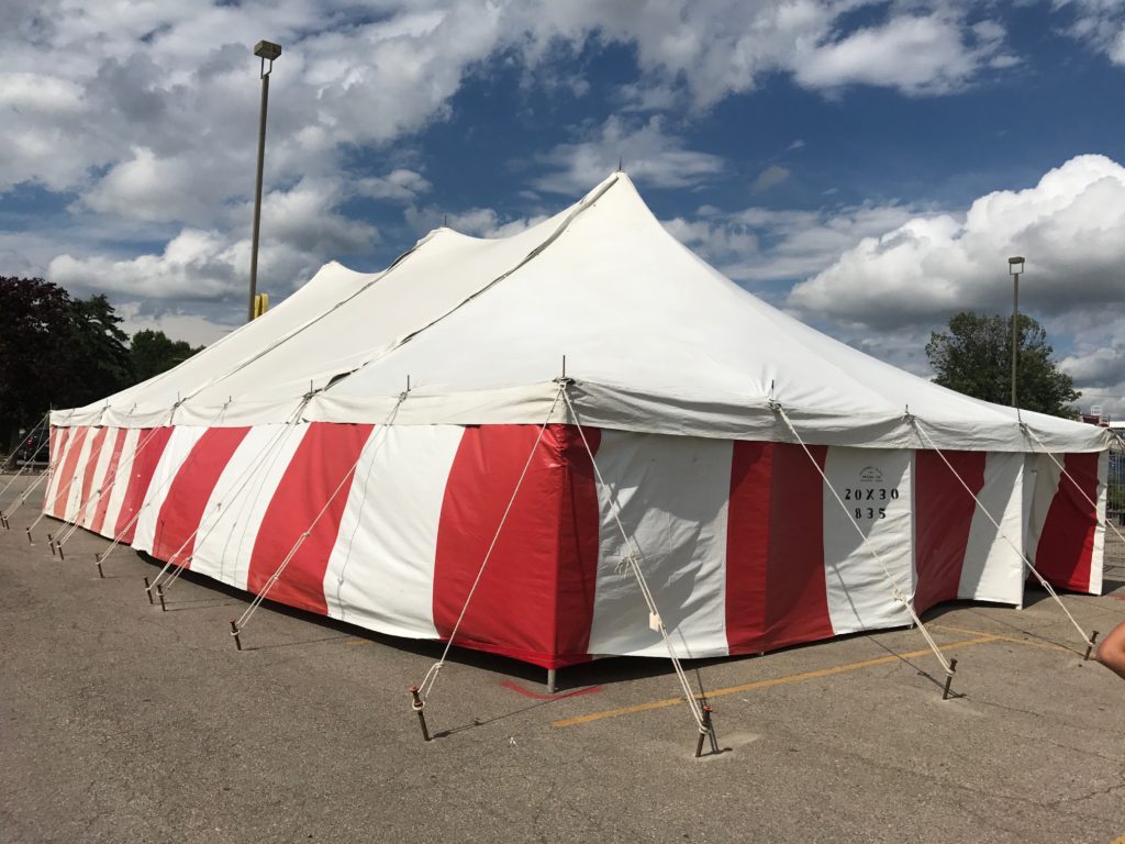 30' x 60' rope and Pole tent with red and white side walls for a Fireworks tent atHy-Vee in Davenport