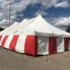 30' x 60' rope and Pole tent with red and white side walls for a Fireworks tent atHy-Vee in Davenport