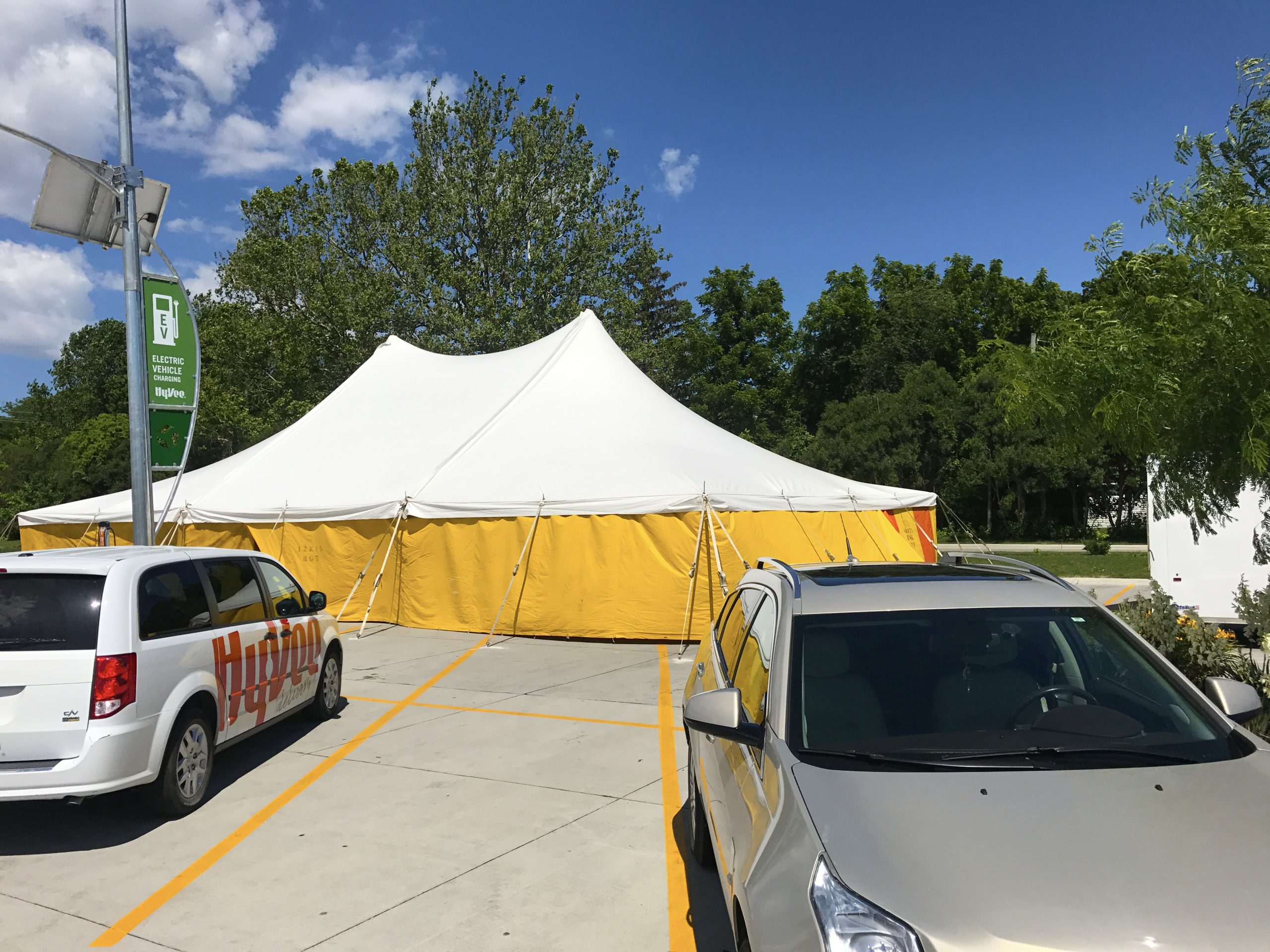 40' x 60' rope and pole fireworks tent at HyVee on Dodge St. in Iowa City with yellow sidewalls