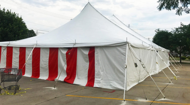 40' x 60' rope and pole tent with Red and White Sidewall used for Fireworks tent at Hy-Vee in Cedar Rapids