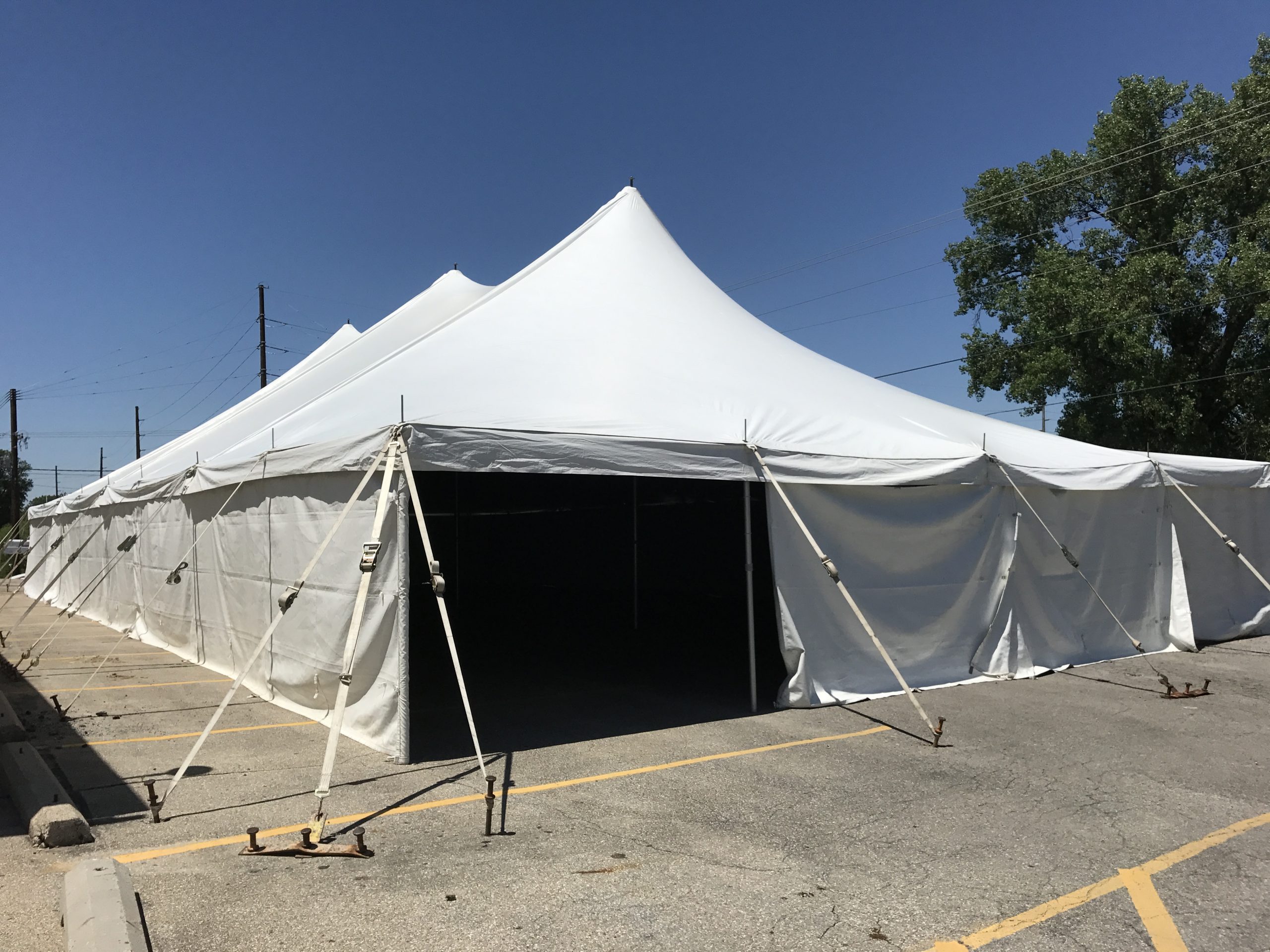 40' x 80' rope and pole tent set up on Asphalt for Store for Homes furniture sale