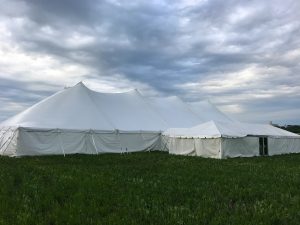 80' x 150' Twin Pole rope and pole tent with 20' x 60' frame tent with a glass door