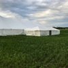80' x 150' rope and pole tent with a 20' x 60' frame tent with a glass door connected by a 10' x 10' frame tent