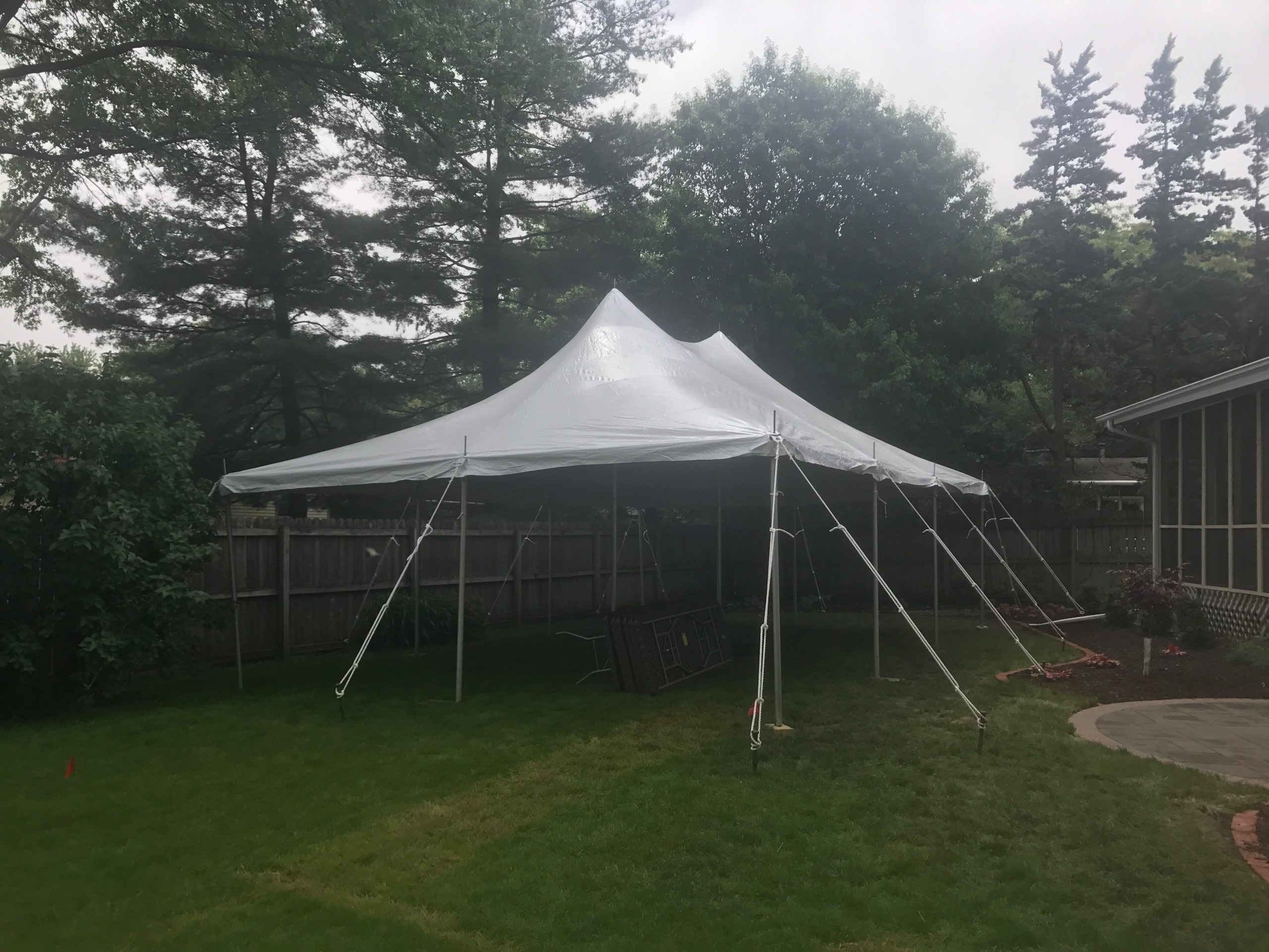 Backyard Graduation Party with 20' x 30' rope and pole tent