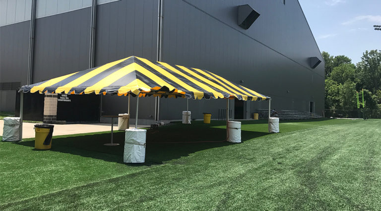 Black and Gold tent for the Ladies Football Academy at the University of Iowa