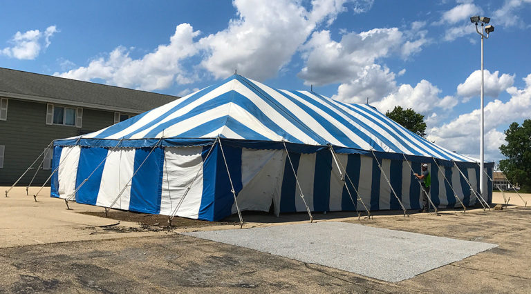 Blue and white rope and pole tent for Fireworks Stand setup in Clinton, Iowa