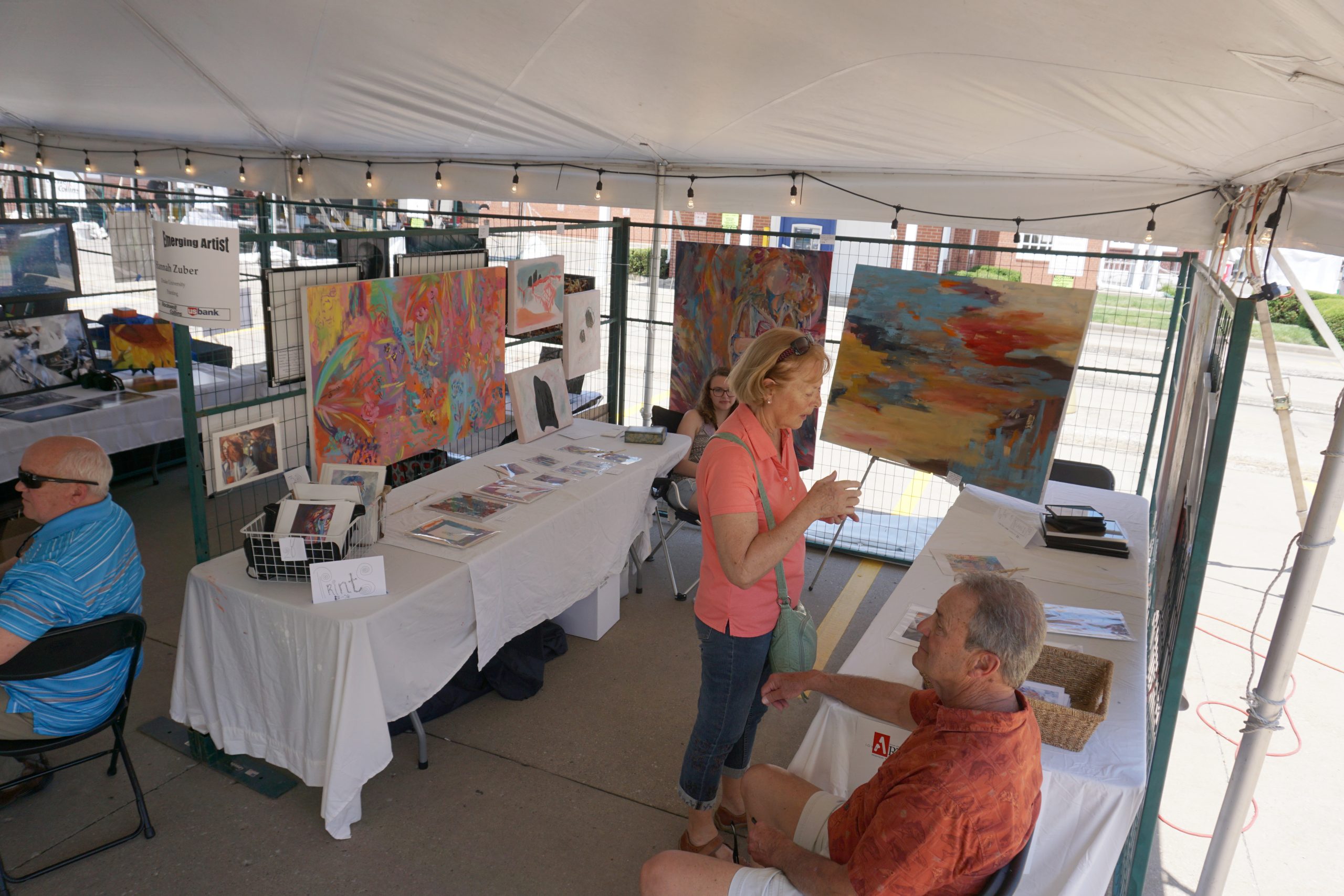 Booth of Hannah Zuber at Emerging Artists exhibit tent at Summer of the Arts Festival