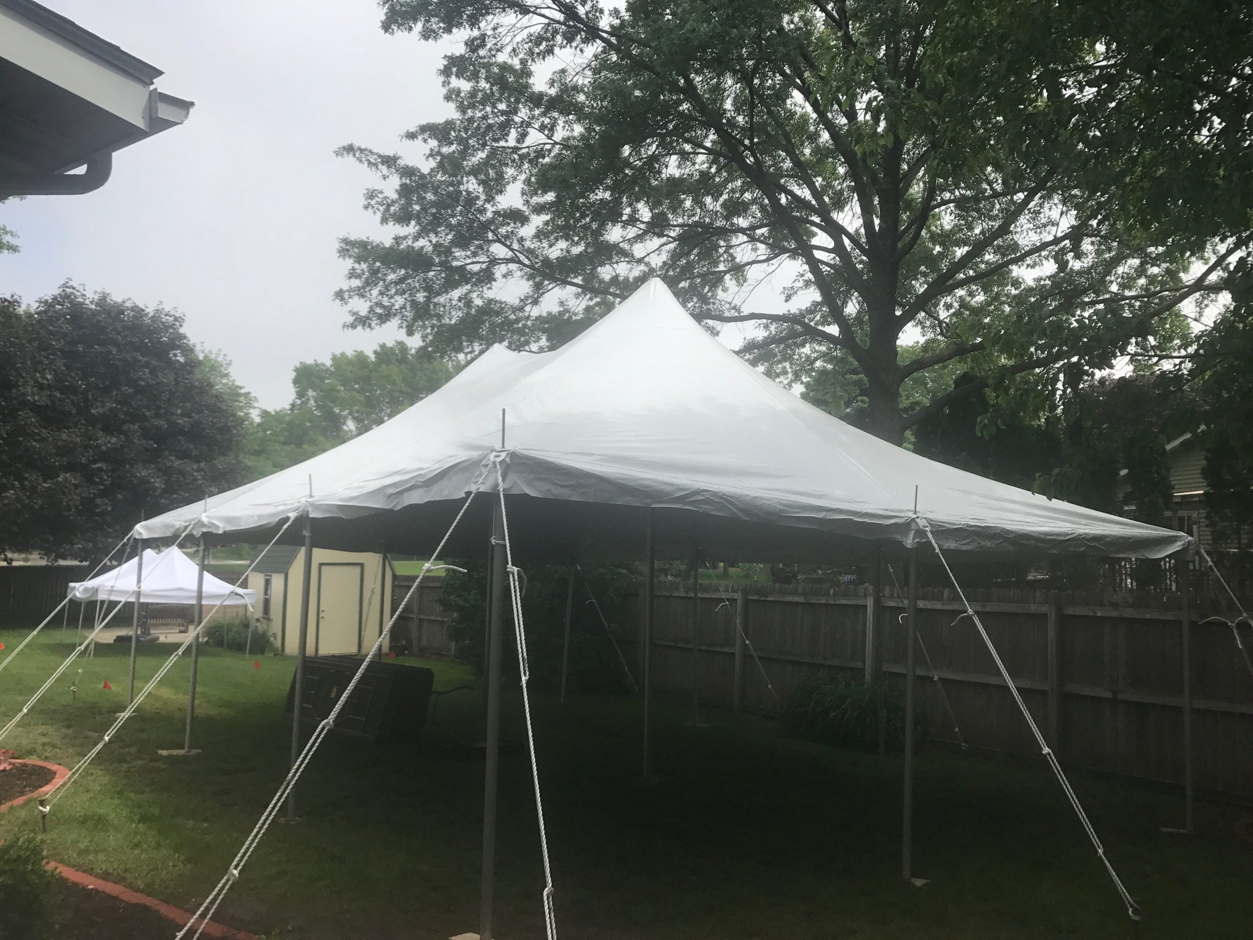 Close fit with this 20' x 30' rope and pole tent in Iowa City