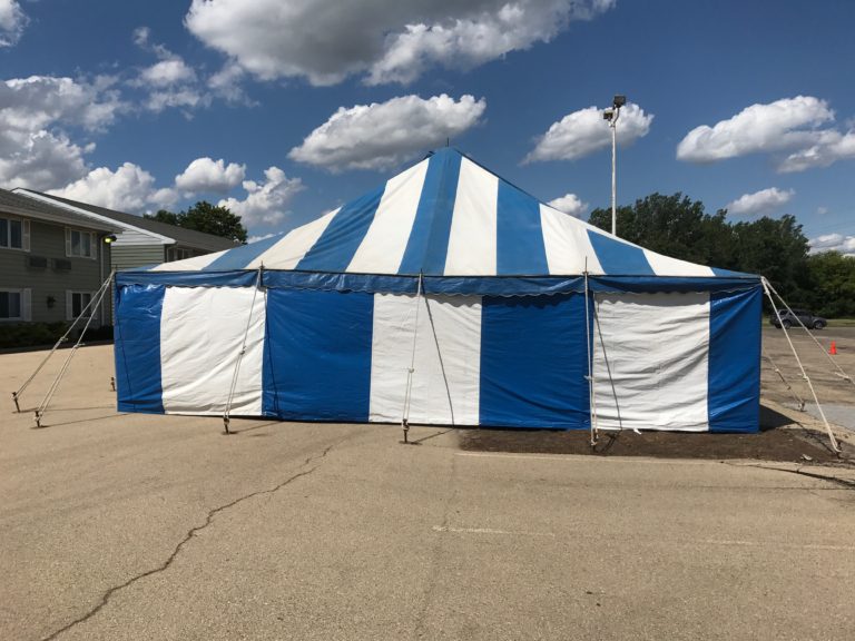 End of the 30' x 60' blue and white rope and pole tent for Fireworks Stand setup in Clinton, IA