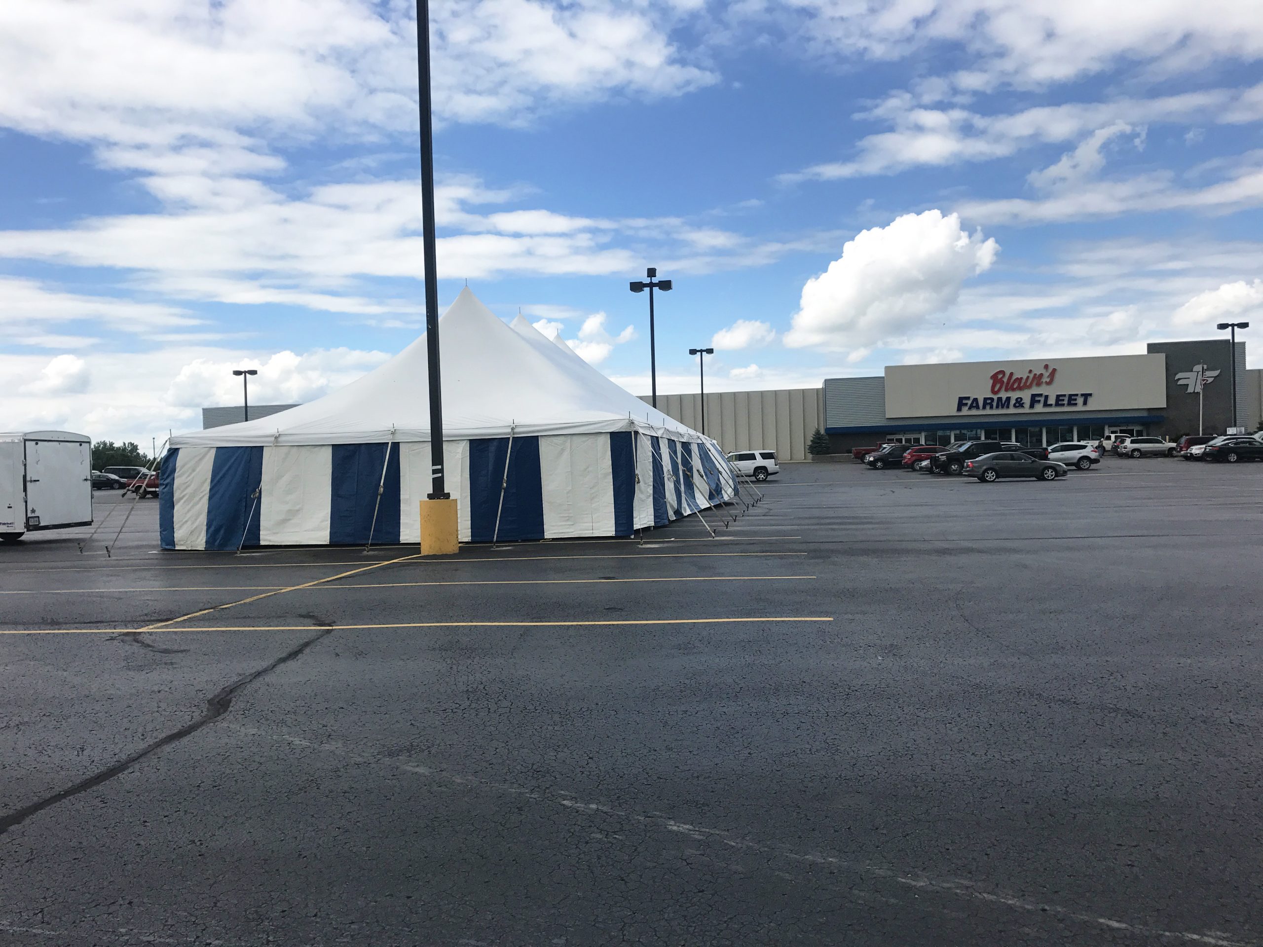 Fireworks stand at Blain's Farm & Fleet in Cedar Falls, Iowa (30' x 60' rope and pole tent with blue and white sidewall)