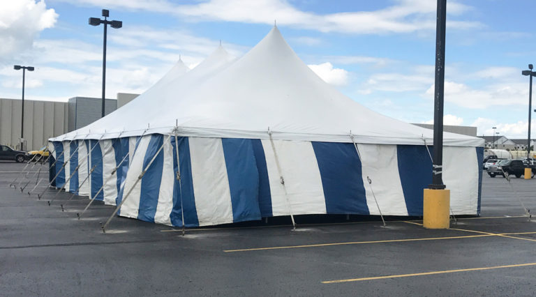 Fireworks stand at Blain's Farm & Fleet parking lot in Cedar Falls, Iowa (30' x 60' rope and pole tent with blue and white sidewall)