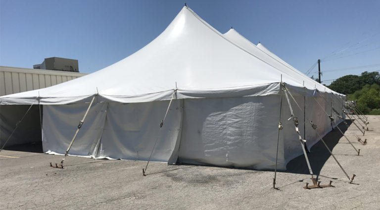 Furniture sale under a 40' x 80' rope and pole tent