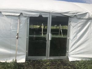 Glass door on a frame tent