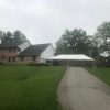 Home with 20' x 40' frame tent next to it for Graduation Party