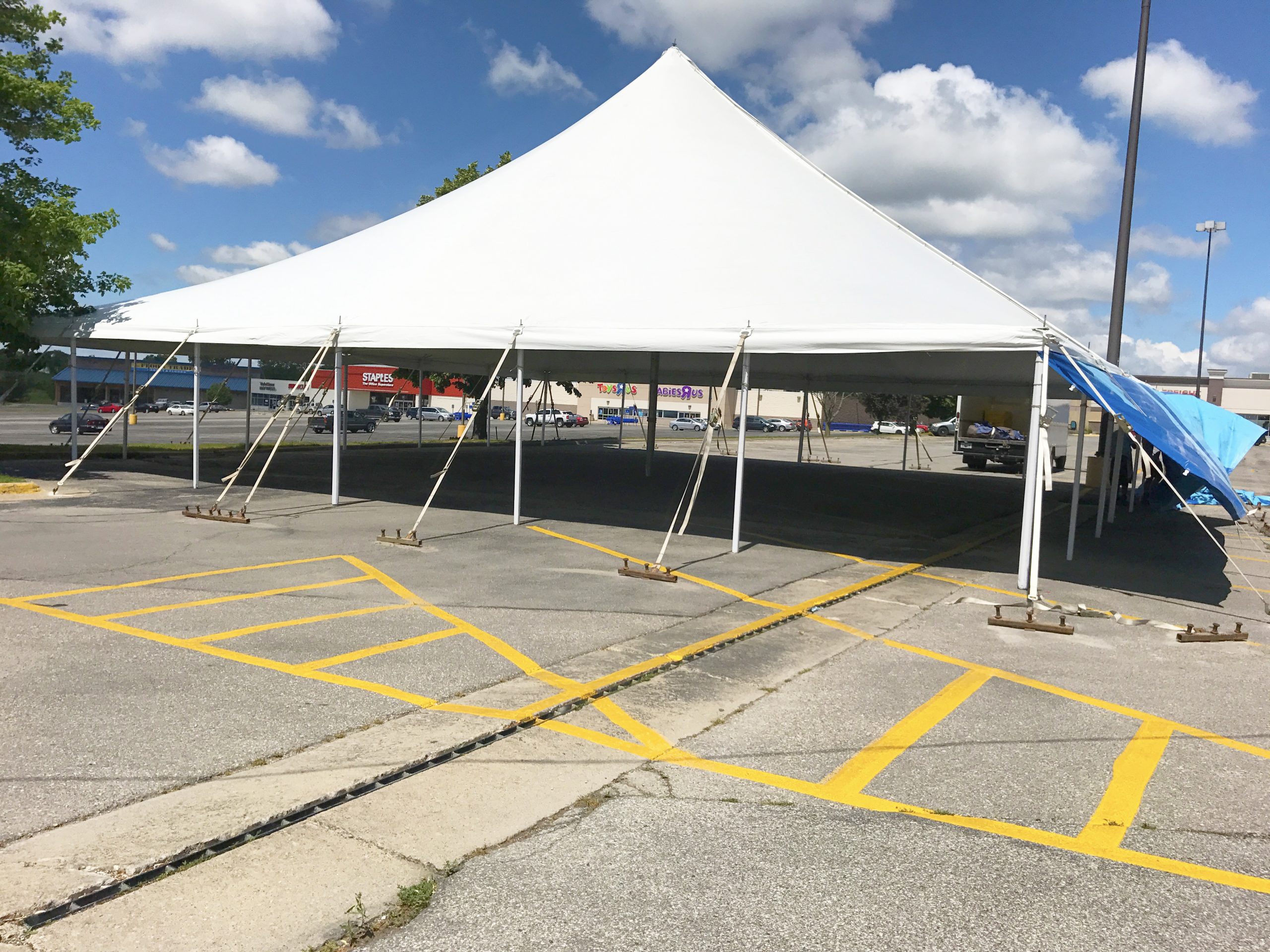 Large 60' x 60' rope and pole tent for fireworks stand in Marion, IA for Bellino Fireworks