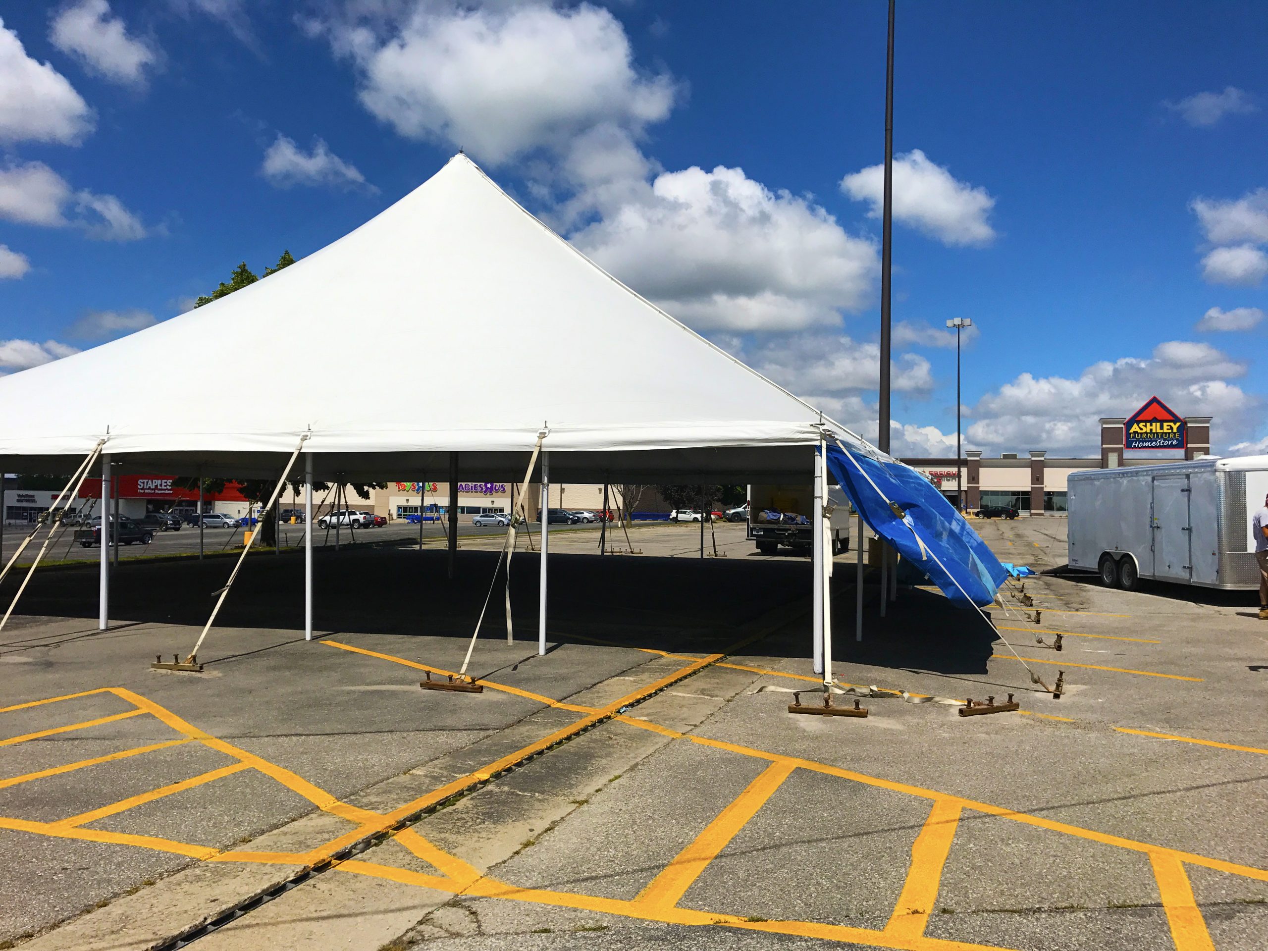 Large 60' x 60' rope and pole tent for fireworks stand in Marion, Iowa for Bellino Fireworks