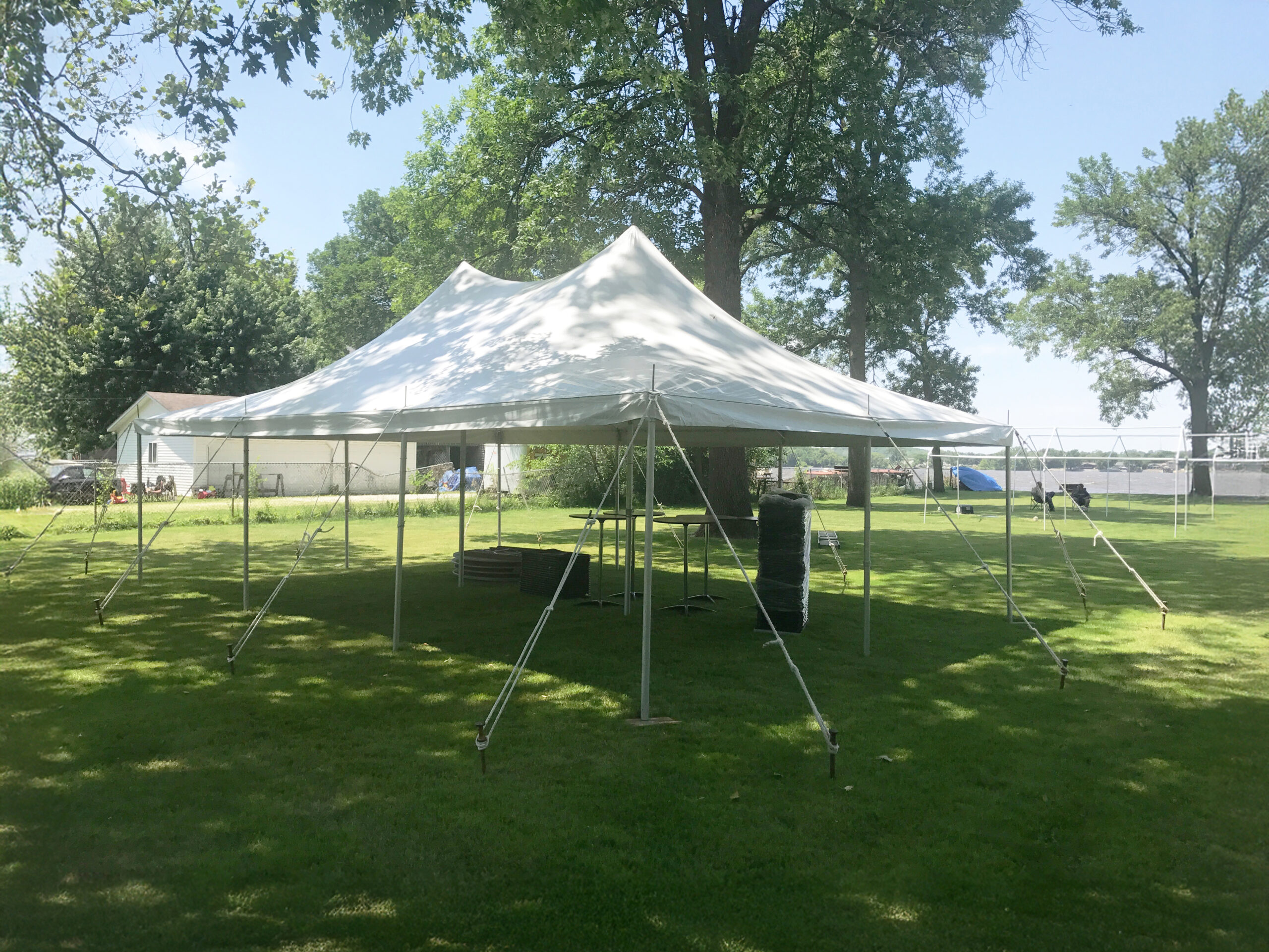 Outdoor graduation party under 20x30 rope and pole tent in East Moline, Illinois.