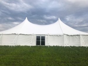 Outside of 60' x 90' rope and pole tent with glass doors