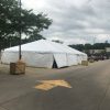 Outside of a 30' x 60' frame tent with white sidewalls for a fireworks stand at Hy-Vee in Cedar Rapids, Iowa