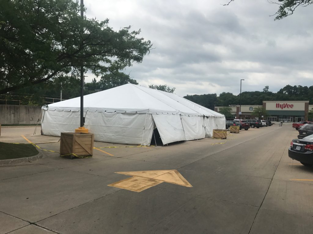 Outside of a 30' x 60' frame tent with white sidewalls for a fireworks stand at Hy-Vee in Cedar Rapids, Iowa