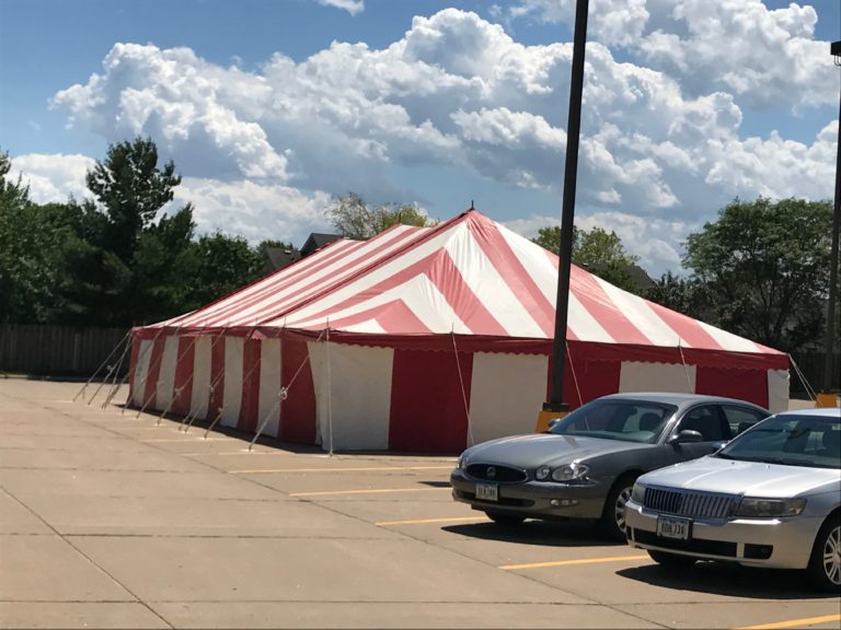 Red And White 30' x 60' rope and pole tent at Fareway Grocery in Davenport, Iowa