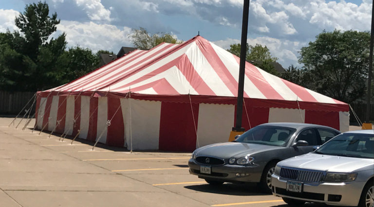 Red and White 30' x 60' rope and pole fireworks tent at Fareway Grocery in Davenport, Iowa