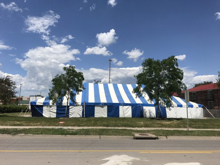 Side of 40' x 70' blue and white rope and pole tent at Hy-Vee S. 1st Ave in Iowa City for Bellino Fireworks