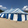 Side of the 30' x 60' blue and white rope and pole tent for Fireworks Stand setup in Clinton, Iowa
