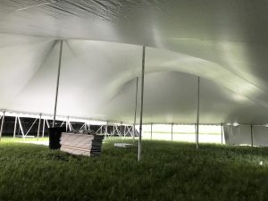 Under a 60' x 90' "Twin Pole" rope and pole tent