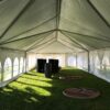Under the 20' x 60' frame tent with French Sidewalls for a wedding reception at a St John Vianney Church in Bettendorf IA