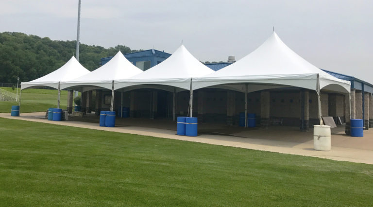 Four 20' x 20' Tentnology frame tents side-by-side at Soccer field