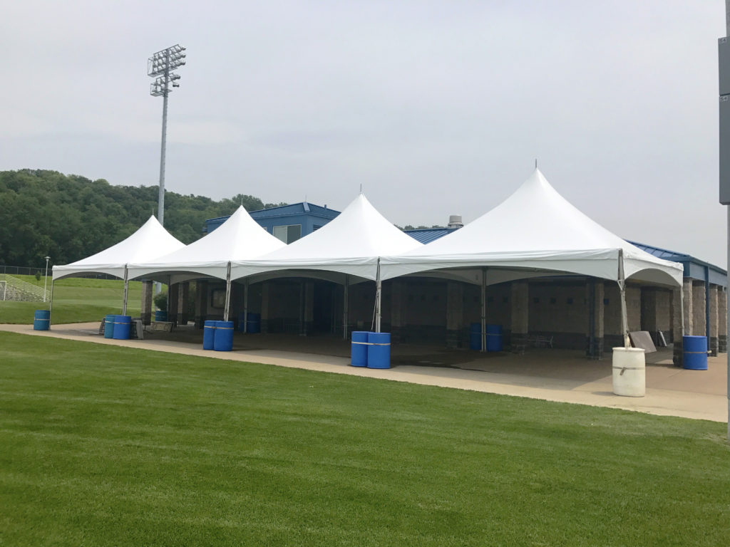 Four 20' x 20' Tentnology frame tents side-by-side at the Muscatine Soccer Field in Iowa