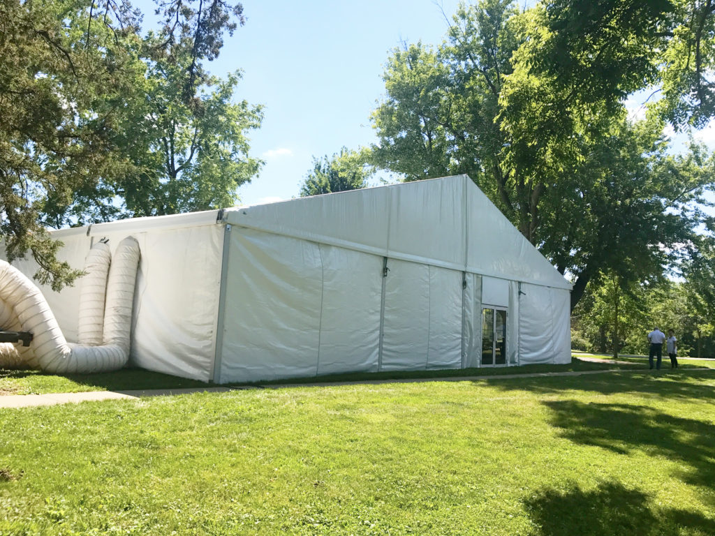 Side of 60' x 66' clearspan Losberger-made tent with two 12-Ton Air conditioning unit outside