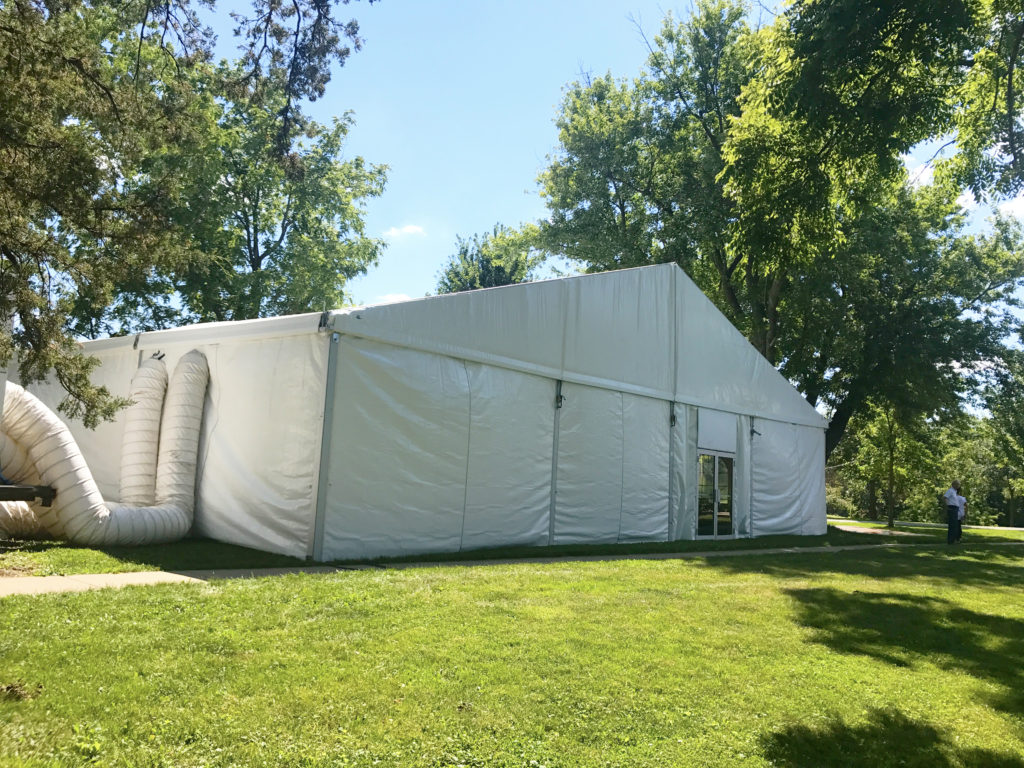 Side of 60' x 66' clearspan Losberger-made tent with two 12-Ton Air conditioning unit outside in Iowa