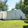 Side of 60' x 66' clearspan Losberger-made tent with two 12-Ton Air conditioning unit outside