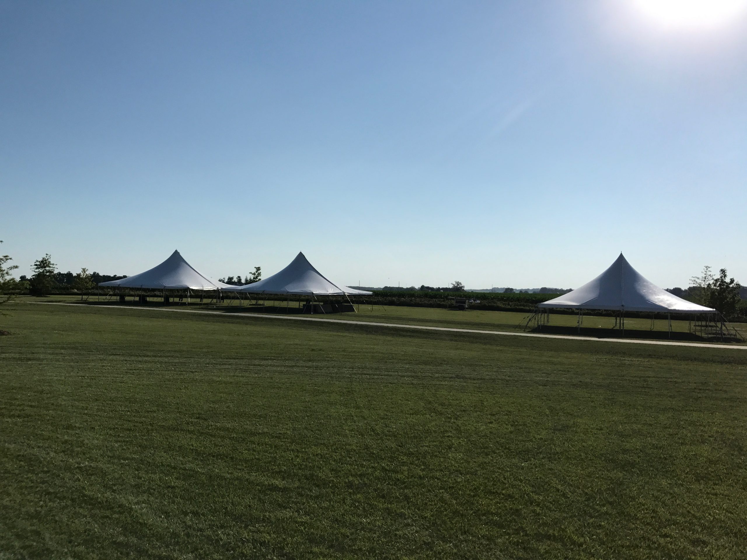 Three 40' x 40' rope and pole tent at the North Liberty Blues & BBQ festival at Centennial Park in North Liberty, Iowa