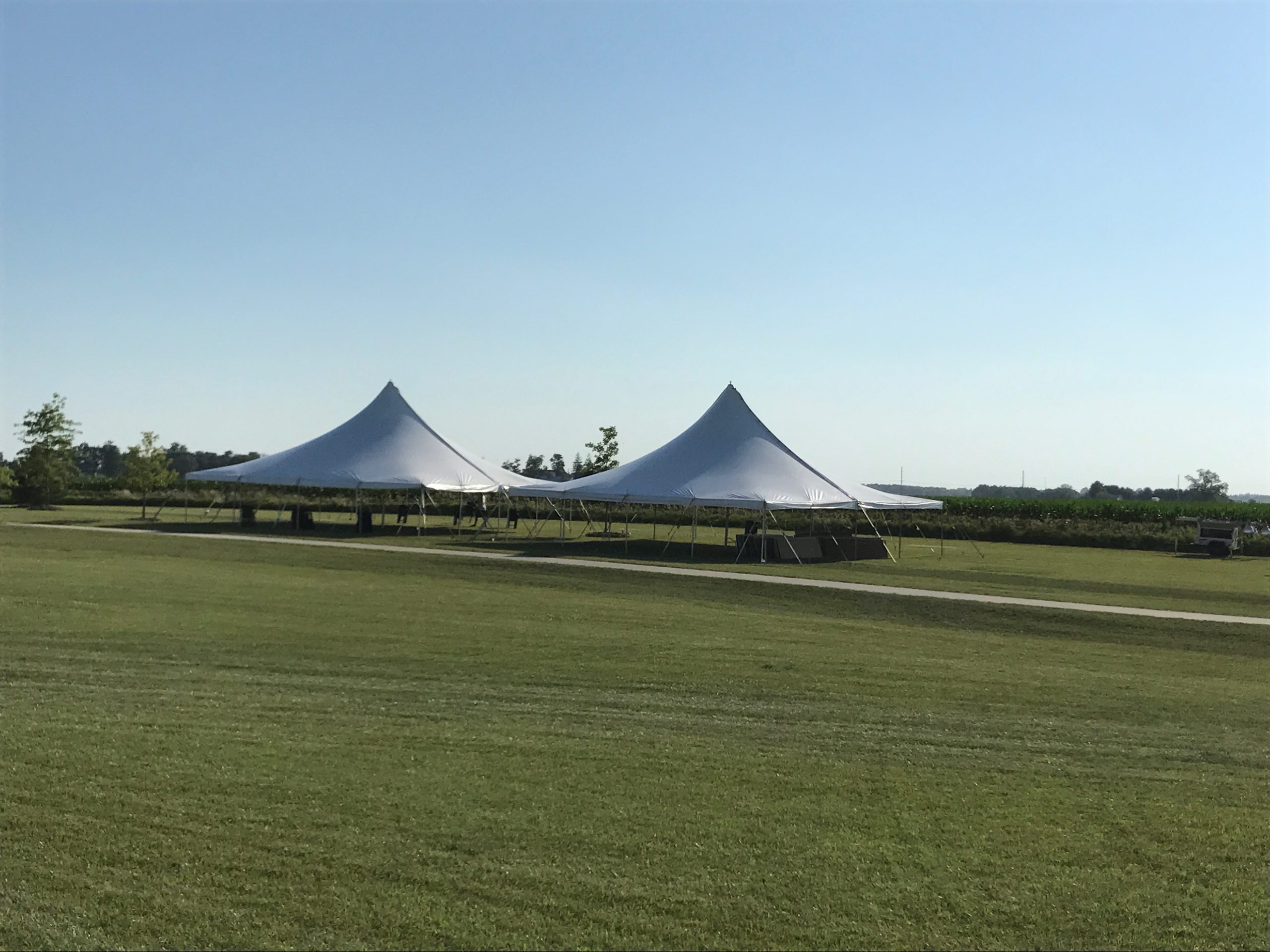 Two 40' x 40' rope and pole tent at the North Liberty Blues & BBQ festival
