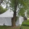 30' x 60' rope and pole wedding tent with white sides Monticello, IA surrounded by trees