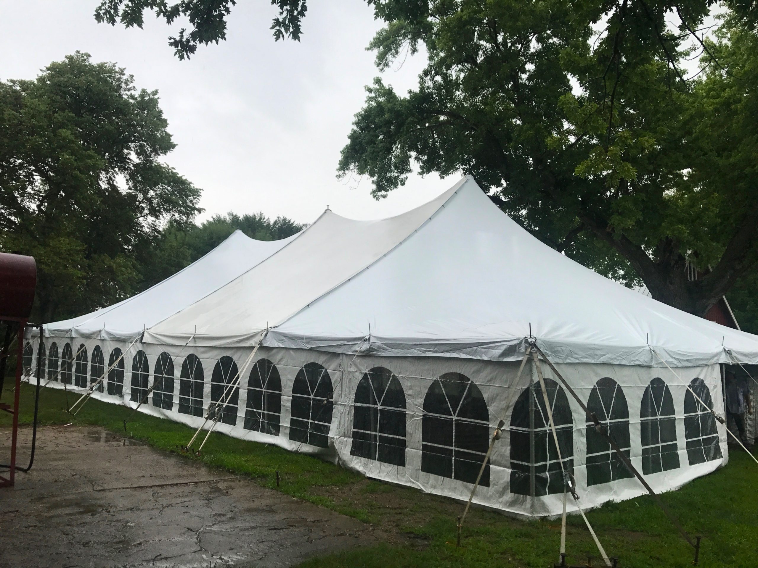 Outside of a 40' x 80' Rope and Pole wedding tent in Carroll Iowa