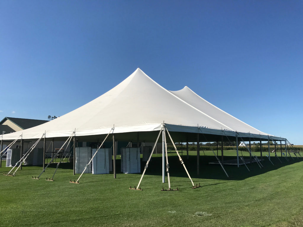 Side of White 60' x 90' rope and pole tent for Outdoor Wedding & Wedding Reception in Newton, Iowa