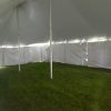 Under the 30' x 60' rope and pole wedding tent with white sides Monticello, IA
