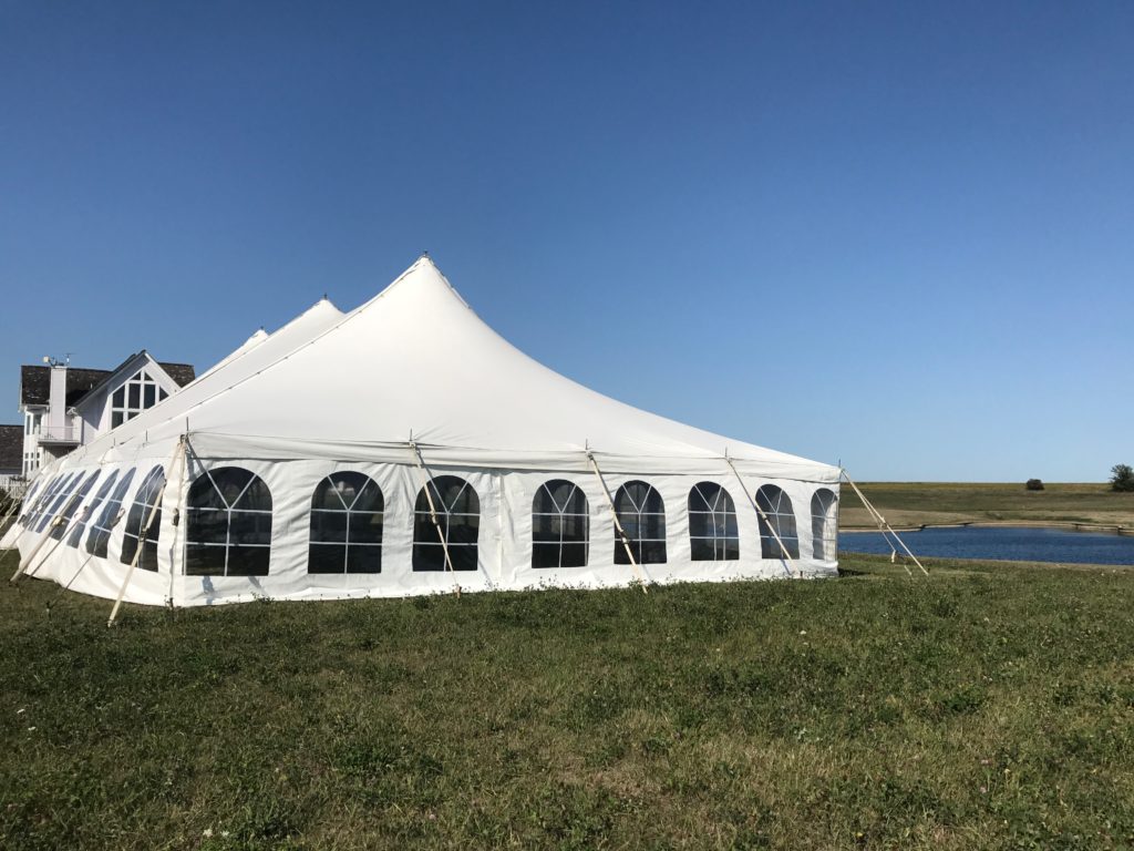 End of 40' x 80' rope and pole wedding tent setup in Fairfield, Iowa