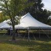 Outside of 40' x 80' rope and pole tent at a campground near Muscatine, Iowa