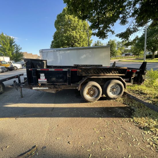 Side of 6' x 14' dump trailer rental in Iowa City, IA VIN-5931