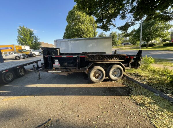 Side of 6' x 14' dump trailer rental in Iowa City, IA VIN-5931